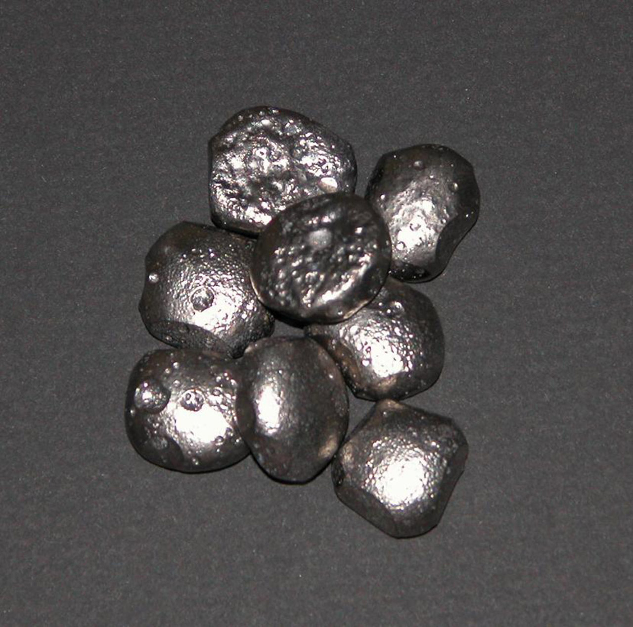 small pile of silver colored iron nuggets